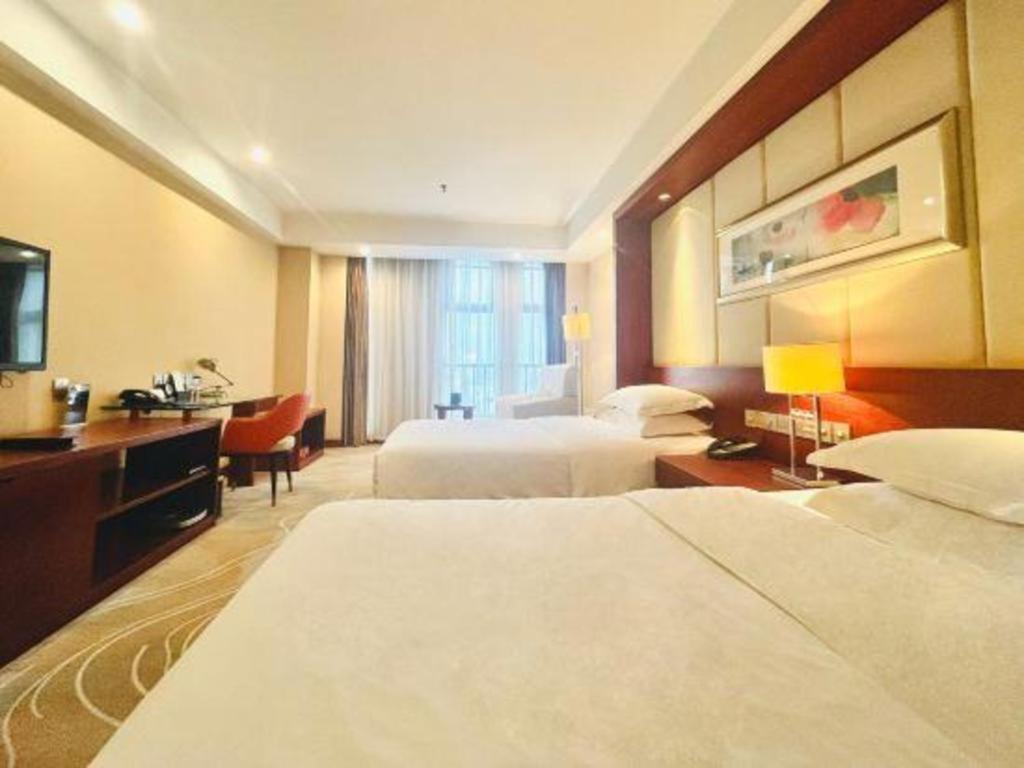 โรงแรมแกรนด์ เมโทรพาร์ค ซางชิว Shangqiu ภายนอก รูปภาพ