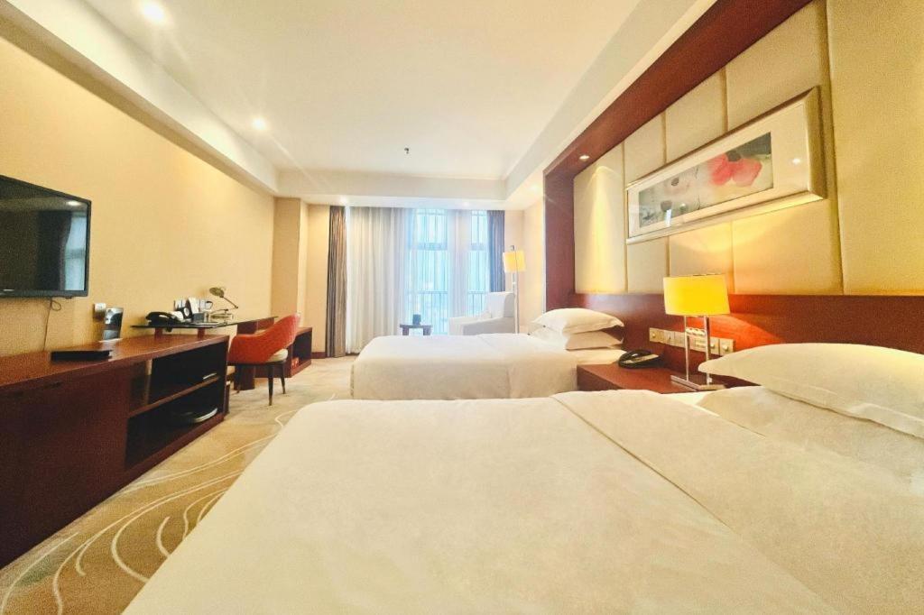 โรงแรมแกรนด์ เมโทรพาร์ค ซางชิว Shangqiu ภายนอก รูปภาพ