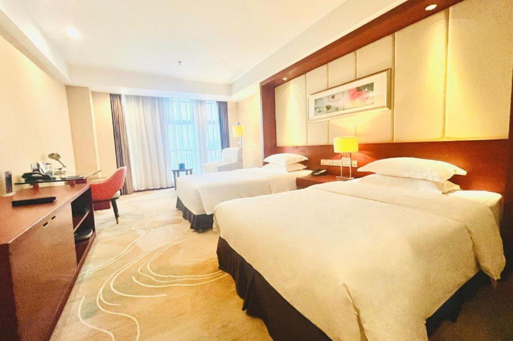โรงแรมแกรนด์ เมโทรพาร์ค ซางชิว Shangqiu ภายนอก รูปภาพ